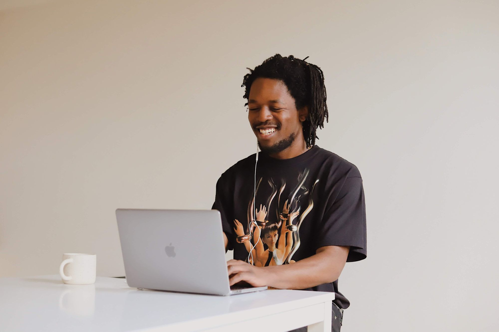 Man smiling looking at laptop