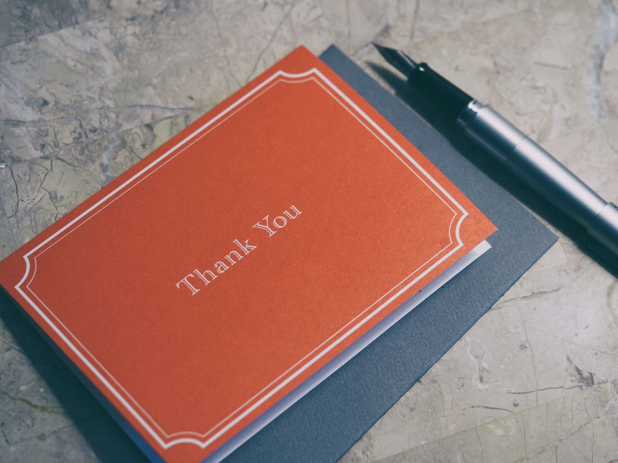 paper card with words " thank you"